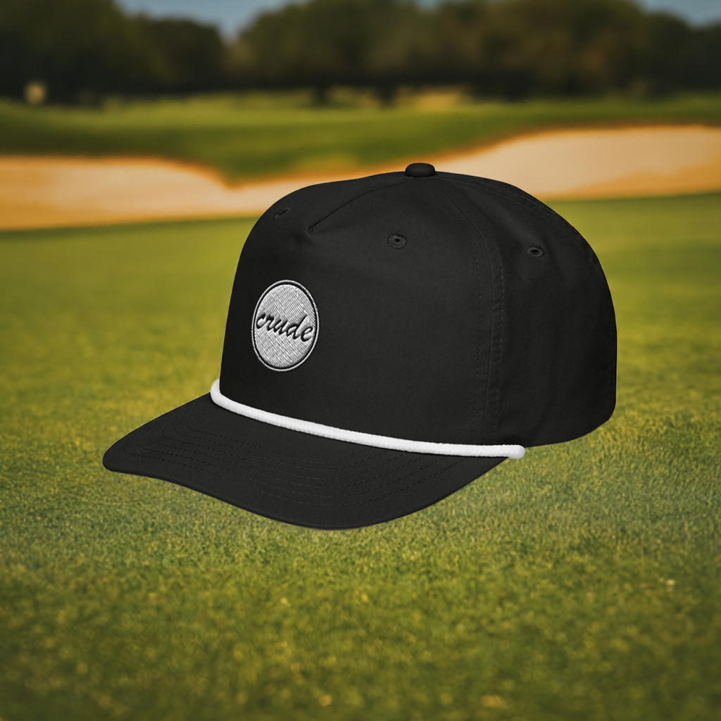 Black & White 5-panel Course Correction Rope Golf Hat with semi-curved bill and snapback closure; crude oil golf hat in front of a golf course