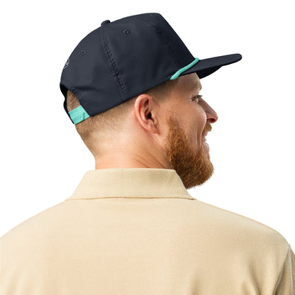 Navy Blue & Teal 5-panel Course Correction Rope Golf Hat with semi-curved bill and snapback closure; crude oil golf hat worn by smiling man